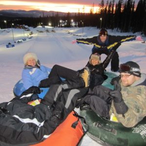 Friends tubing down the Mega Snow Coaster